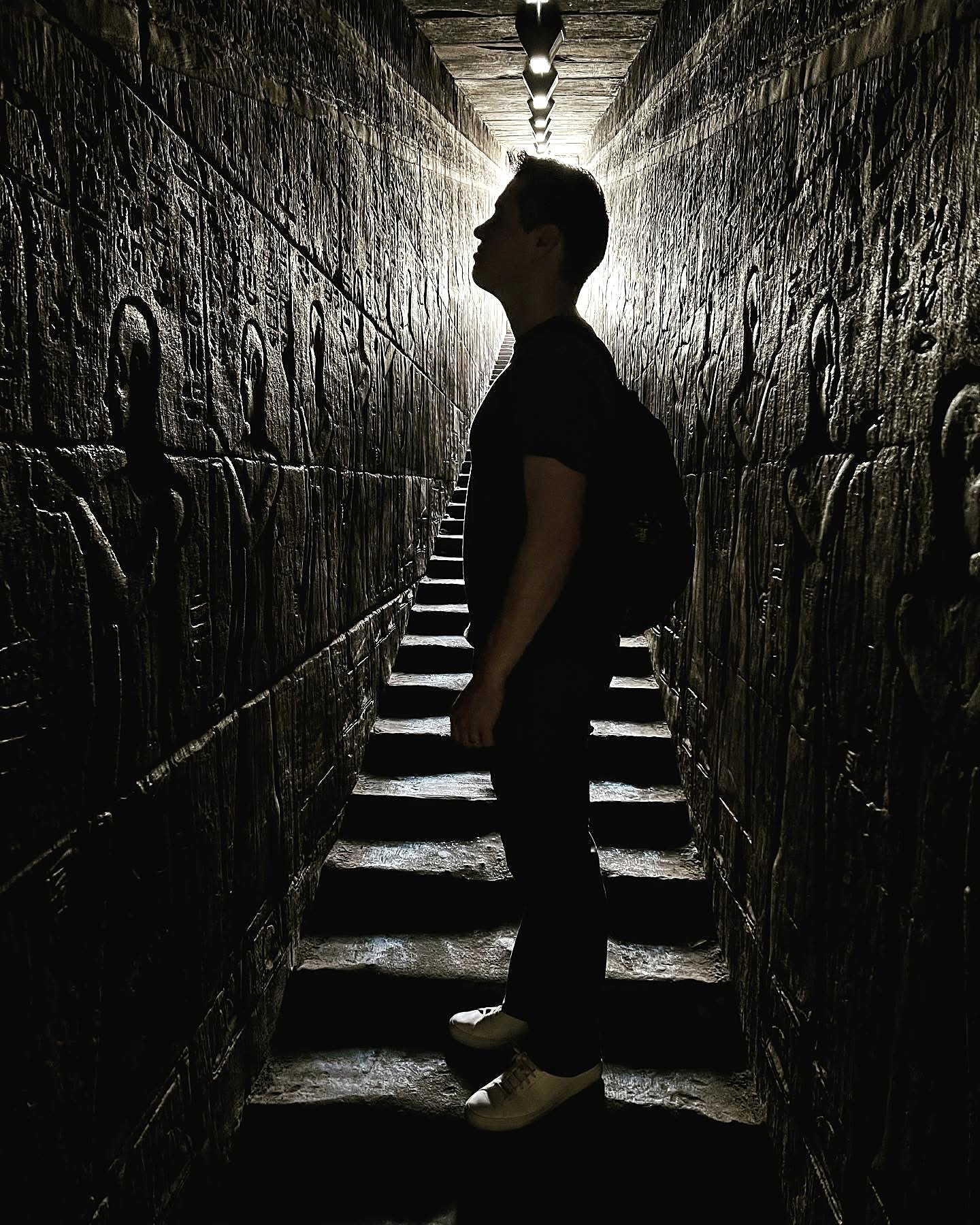 Bryen Alperin in a carved corridor at an Egyptian temple